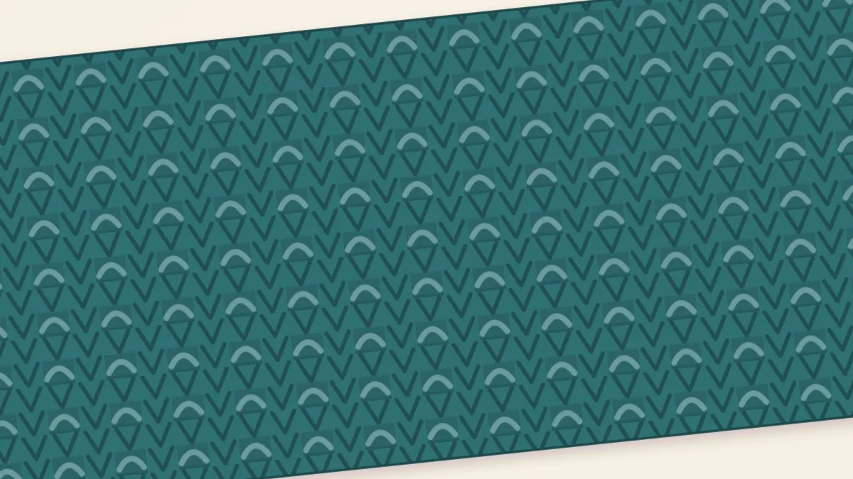 Close view of a broken rib scarf in teal showing columns of small bumps between smooth knit columns