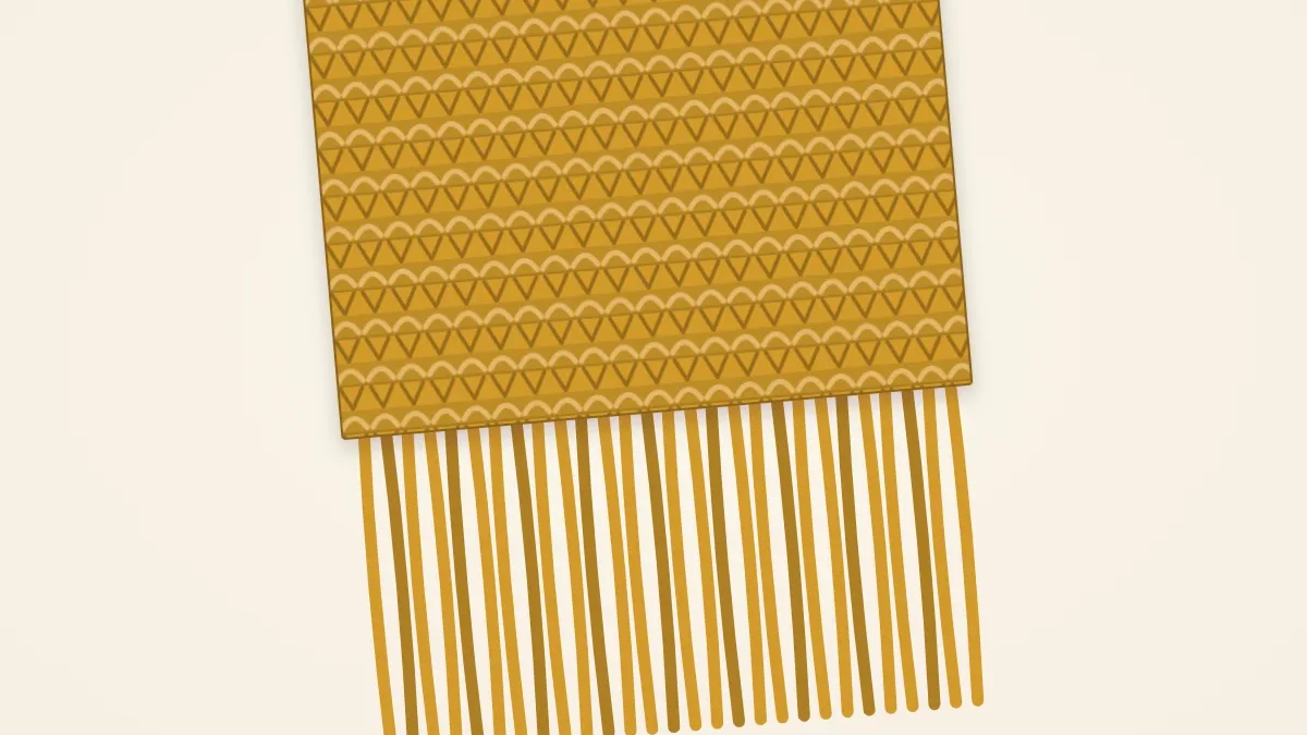 The end of a mustard yellow scarf finished with a row of even fringe