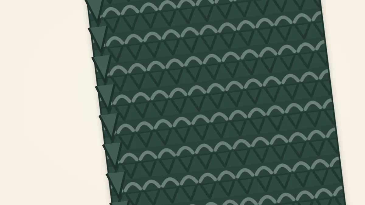 Close-up of a knitted scarf side edge with a tidy chain of slipped stitches running along it