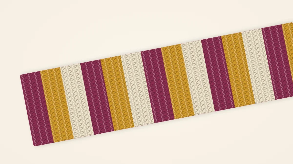A striped knitted scarf in mulberry, mustard and cream